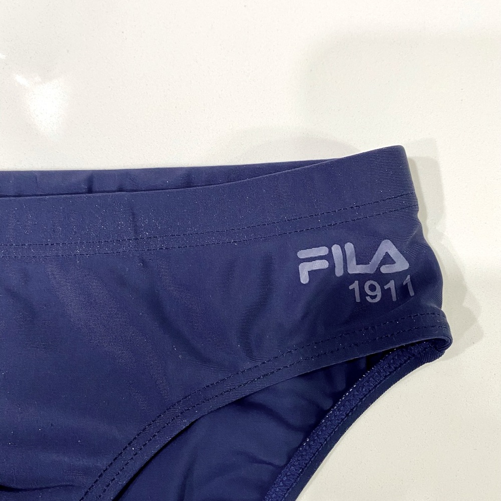 FILA swimming brief for boys. See pic for size info.NWOT. Color dark blue.